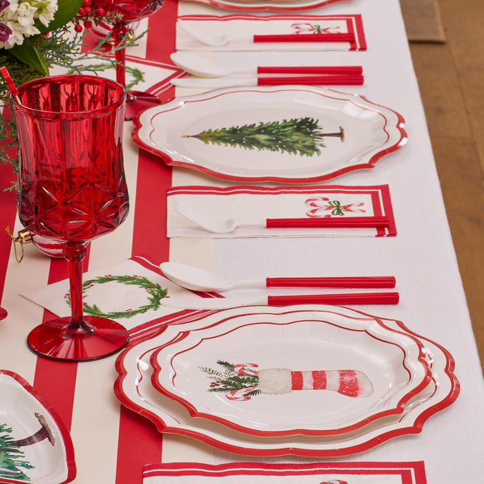 Create a festive holiday table setting with Sophistiplate’s Merry and Bright Salad Plates (8-pack), featuring delightful Christmas designs. Complete the look with red utensils, red glass goblets, napkins adorned with holiday motifs, and a vibrant floral centerpiece for a truly Merry and Bright celebration.