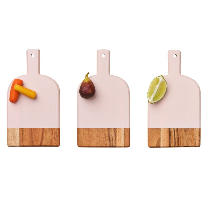Three Maple Mini Bevel Boards - Set of 3 with Ribbon, Pink (8 x 4.25"), are arranged side by side with two carrot sticks on the left, a whole fig in the center, and a lime half on the right.