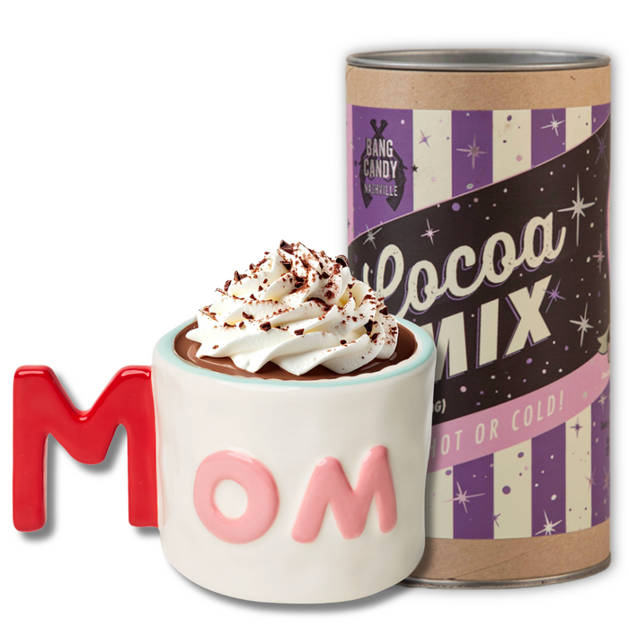 The Mom Mug + Cocoa Gift Set by Sophistiplate LLC features a charming mug and Bang Candy Company Cocoa Mix—an ideal hot cocoa gift set and a delightful present for Mom.