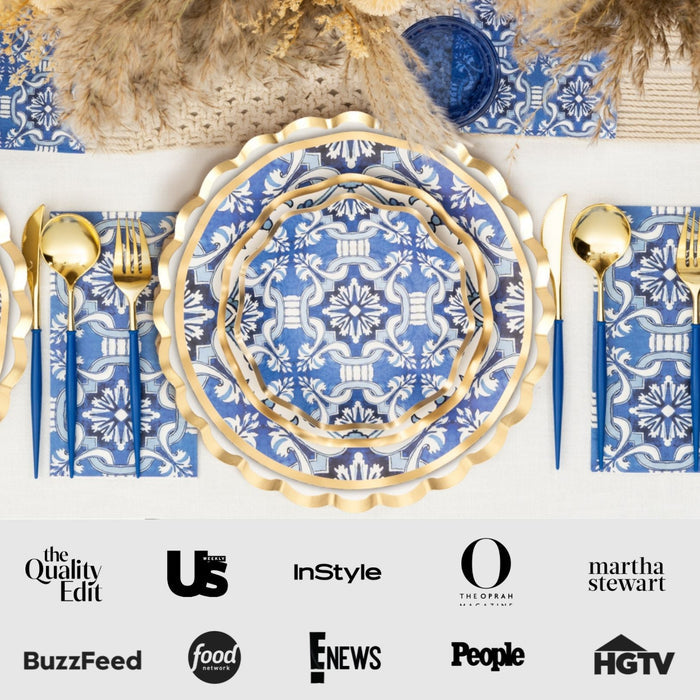 The Moroccan Table Setting by Sophistiplate LLC features blue and white patterned scalloped disposable plates and gold utensils, neatly arranged. Media logos below include BuzzFeed, HGTV, and Martha Stewart.
