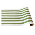 The Hester & Cook Moss Classic Stripe Runner (20x25") features alternating green and white stripes, ideal for gift wrapping or as a festive table runner, shown partially unrolled on a white surface.