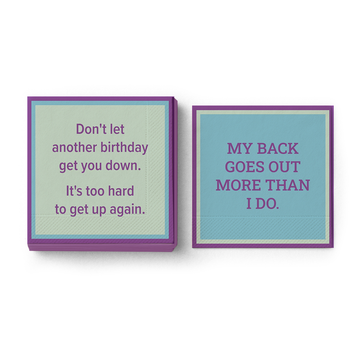 Add humor to your party with Drinks On Me’s "My Back Goes Out Napkin" set—two cocktail napkins with purple trim: one quips, “Don’t let another birthday get you down,” the other, “MY BACK GOES OUT MORE THAN I DO.”.