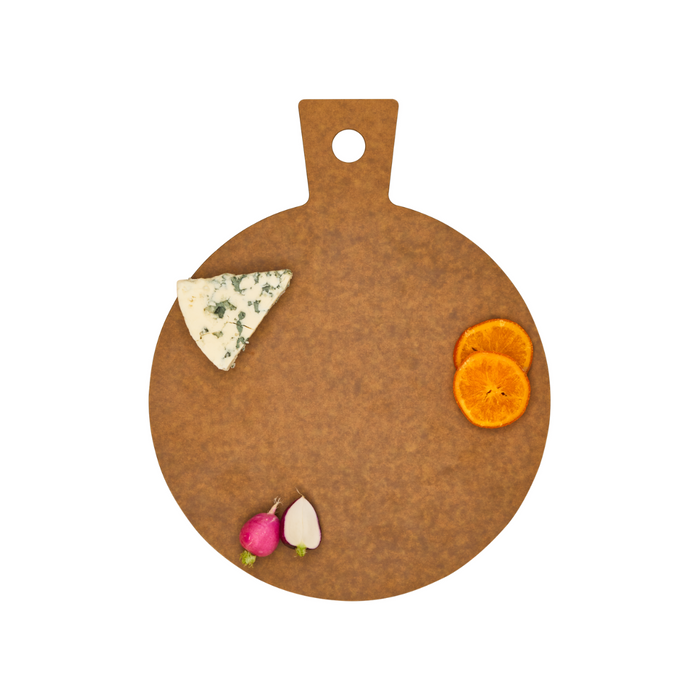 The Maple Natural Wood Composite Round Hostess Board with handle displays blue cheese, orange slices, a radish, and garlic clove on a white background.
