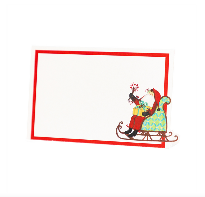 The Hester & Cook Old St. Nick Place Cards (12ct) feature Santa Claus in a green chair with a bird and holly on a blank card with a red border—ideal for charming Christmas table decor.