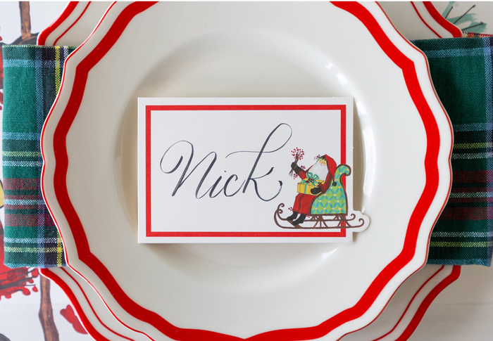 Add a festive touch to your holiday table with Hester & Cook’s Old St. Nick Place Cards (12ct), featuring Santa in a sleigh—perfect for Christmas gatherings.