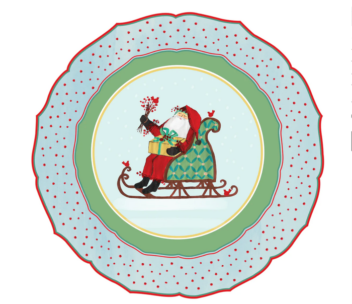 The Hester & Cook Old St. Nick Placemats (12ct) feature Santa Claus in a green sleigh with gifts, surrounded by red birds and holly on a snowy blue, red-polka-dot background—ideal for festive holiday table decor.