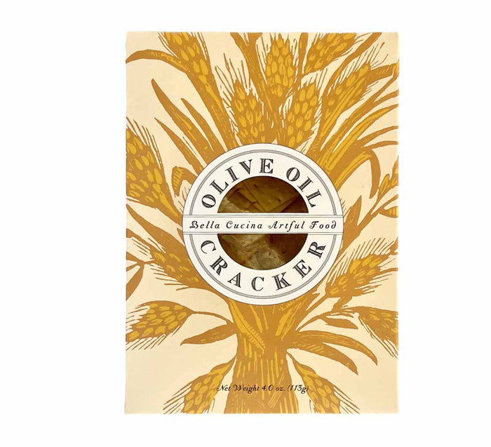 A box of Bella Cucina Olive Oil Dipping Crackers, with an illustration of golden wheat and a circular product label; net weight 4 oz (115 g) is displayed below—an elegant gourmet snack.
