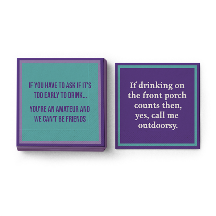 Add humor to your bar cart with two Drinks On Me “Outdoorsy Napkin” cocktail napkins—one teal and purple with bold text, the other says: If drinking on the front porch counts then yes, call me outdoorsy.