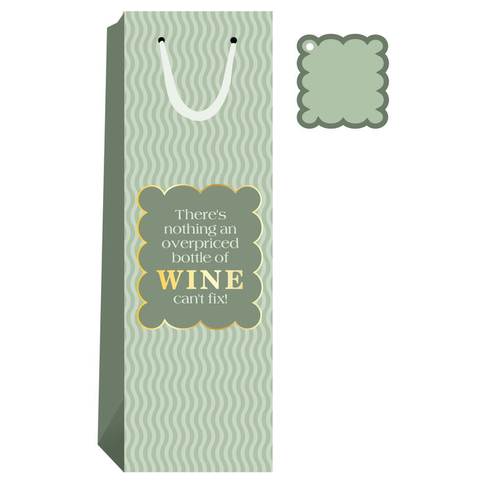 The Drinks On Me "Overpriced Bottle" Wine Bag is green with a wavy pattern, white handle, and reads "There's nothing an overpriced bottle of wine can't fix!" Comes with a matching gift tag—ideal for hostess gifts.