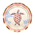 The Pastel Sea Salad Plates (8-pack) by Sophistiplate are beautifully decorated with gold and pink rims, a charming sea turtle illustration at the center, and blue coral-inspired accents along the edges—making them an excellent choice for anyone looking for unique ocean-themed or sea turtle plates to elevate their next gathering.