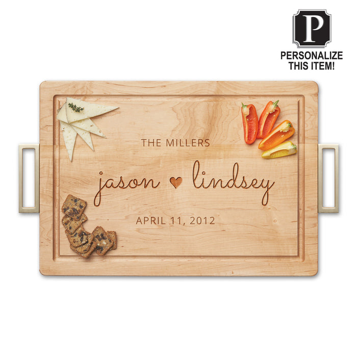 Personalized Maple Wood Cutting + Cheeseboard by Maple, engraved with THE MILLERS, jason ♥ lindsey, and APRIL 11, 2012. Cheese, crackers, and peppers are displayed on this custom charcuterie board. "Personalize This Item!" icon shown top right.