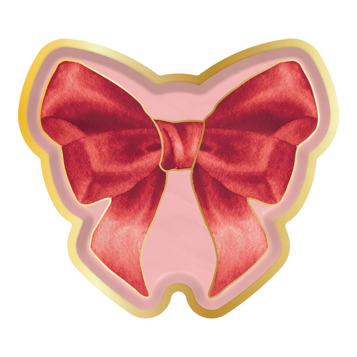 Sophistiplate’s Pink Bows Assorted Die Cut Salad Plates (8pk) feature a decorative red velvet bow on a pink background with a gold border, perfect for adding elegance to your Valentine’s Day party.