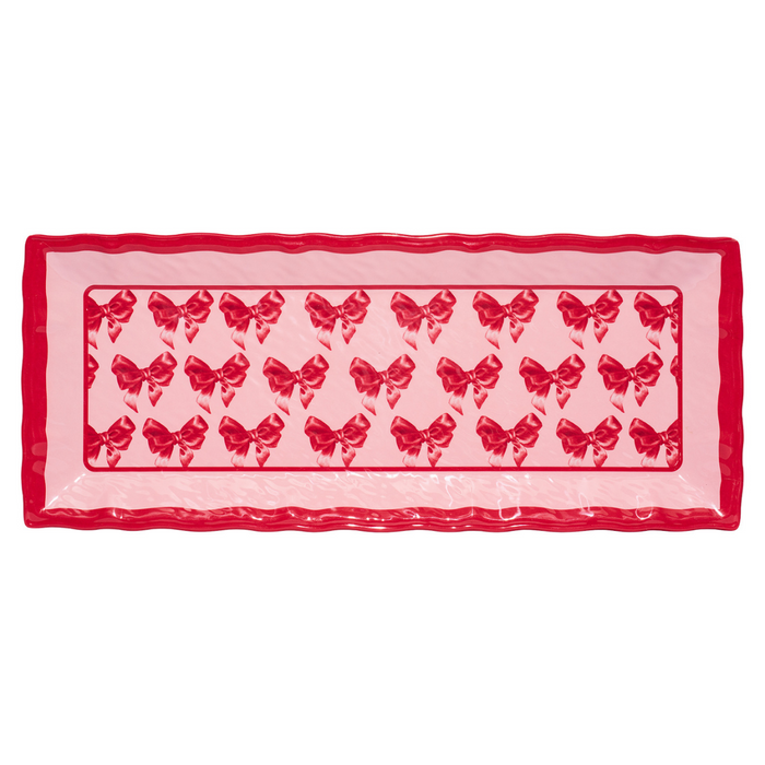 The Sophistiplate Pink Bows Melamine Serving Platter features shiny red edges and a neat pink bow pattern, making it a charming tray for any occasion.