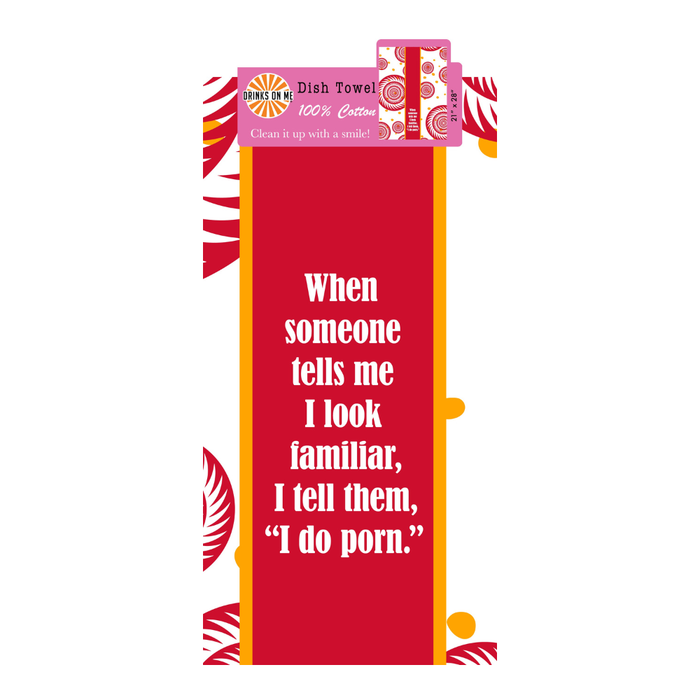The Porn Dish Towel by Drinks On Me is a red kitchen towel with white and yellow borders, featuring the text: "When someone tells me I look familiar, I tell them, I do porn." A playful novelty housewarming gift.
