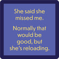 The Reloading Coaster by Drinks On Me features a blue background with yellow text: "She said she missed me. Normally that would be good, but she's reloading." A funny bar cart accessory for coaster lovers.