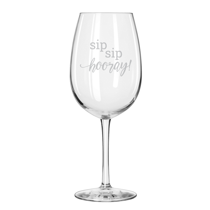 The Maple Reserve Wine Glass | Sip Sip Hooray! | 19.75oz features "sip sip hooray!" laser engraved in light gray script on the bowl, and has a clear, long-stemmed design.
