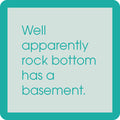 Centered light green text reads, “Well apparently rock bottom has a basement,” on the Rock Bottom Coaster by Drinks On Me. This funny coaster with a thick mint border is perfect for bar cart accessories or gifts.
