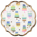 The Sophistiplate Salad Plate Birthday Candles/8ct features scalloped edges, gold rims, and colorful cake, candle, and confetti designs on white—perfect festive plates for birthday celebrations.