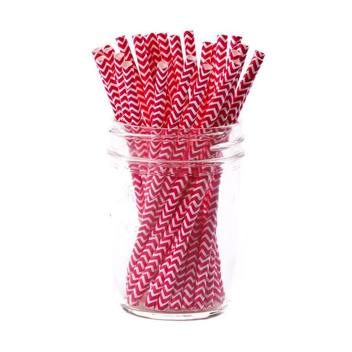 A clear glass jar holds Scarlet Chevron Paper Cocktail Straws by Simply Serv'd (25pk), featuring red and white chevron patterns—ideal for festive drinks or as a thoughtful hostess gift.