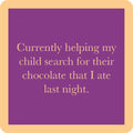 The Drinks On Me Search for Chocolate Coaster features a purple square with a tan border and the funny quote: “Currently helping my child search for their chocolate that I ate last night”—perfect for bar carts or housewarming gifts.