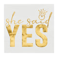 Sugarplum’s She said Yes Cocktail Napkins (26pk) feature "she said YES" in gold and a diamond ring above "said"—perfect for bridal showers or bachelorette parties.