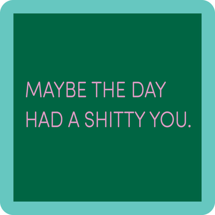The Shitty You Coaster by Drinks On Me features pink text on a green square with a teal border—perfect as a funny drink coaster and quirky addition to your bar cart or housewarming gifts.
