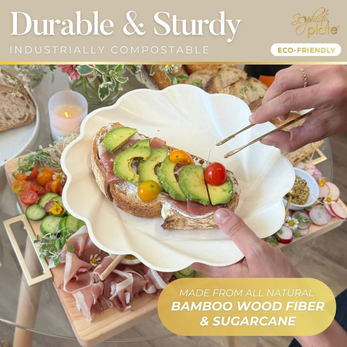 A person uses tongs to add avocado and cherry tomatoes to prosciutto toast, served on Sophistiplate’s Eco-Friendly Table Setting in Cream—bamboo wood fiber plates that are compostable and sustainably made.