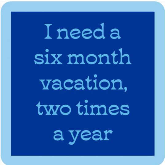 Blue square "Six Month Vacation Coaster" by Drinks On Me features a light blue border and center text: I need a six month vacation, two times a year. A playful choice for drink coaster collectors or unique bar cart accessories.