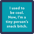 The Drinks On Me Snack Bitch Coaster is a teal square with a dark blue border and white text: "I used to be cool. Now, I’m a tiny person’s snack bitch"—a funny gift for housewarmings or bar carts.