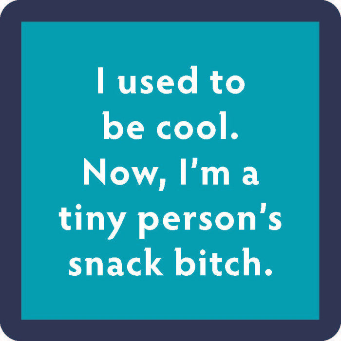 The Drinks On Me Snack Bitch Coaster is a teal square with a dark blue border and white text: "I used to be cool. Now, I’m a tiny person’s snack bitch"—a funny gift for housewarmings or bar carts.