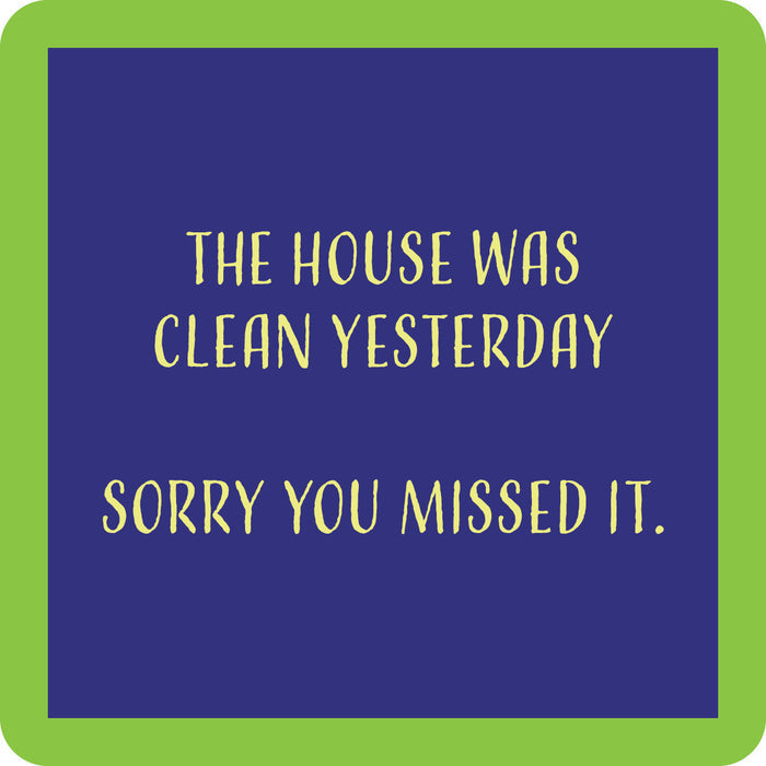 The Sorry You Missed It Coaster by Drinks On Me is a blue square with a green border and yellow text: "The house was clean yesterday. Sorry you missed it." A funny coaster, perfect for housewarming gifts or bar cart accessories.