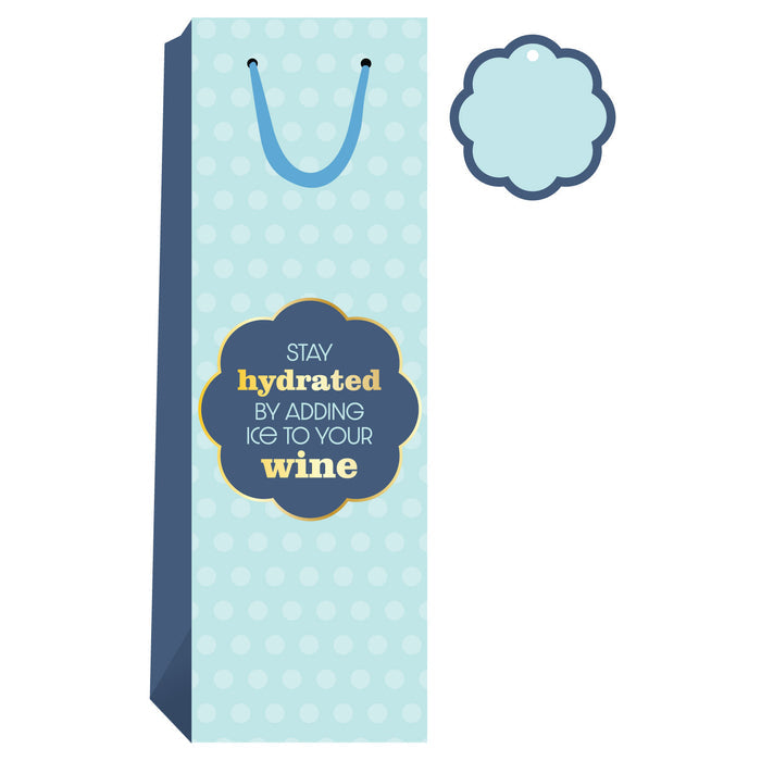 The Drinks On Me Stay Hydrated Wine Bag features light blue with white polka dots, blue panels and handle, a fun "Stay hydrated by adding ice to your wine" label, plus a matching gift tag—perfect for hostess gifting.