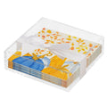 The Sophistiplate Thanksgiving Cocktail Napkin with Napkin Tray features autumn-themed napkins with blue and orange pumpkins and leaves, tied with a white ribbon—a stylish touch for any modern table.
