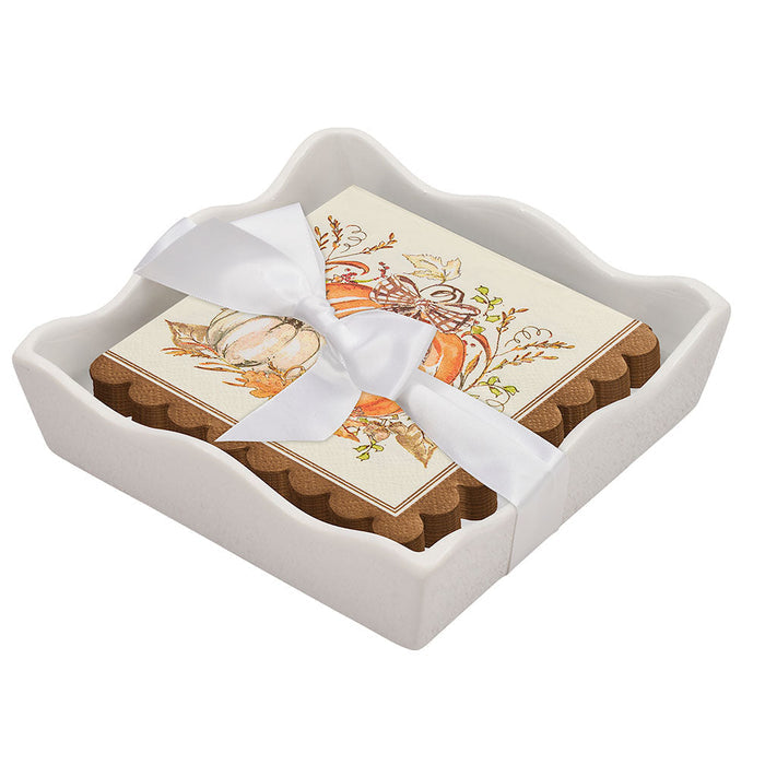 The Sophistiplate Thanksgiving Cocktail Napkin with Napkin Tray features fall-themed napkins neatly stacked in a white ceramic holder—perfect for adding seasonal charm to your modern tabletop.