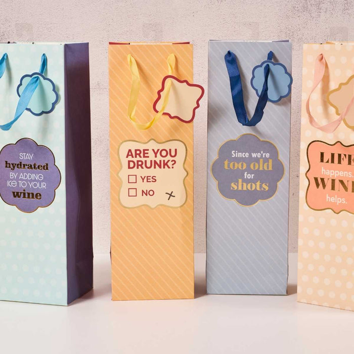 The Drinks On Me "Too Old" wine bag adds a humorous twist to gifting, featuring witty messages and vibrant colors—perfect for presenting wine in a reusable, eye-catching style.