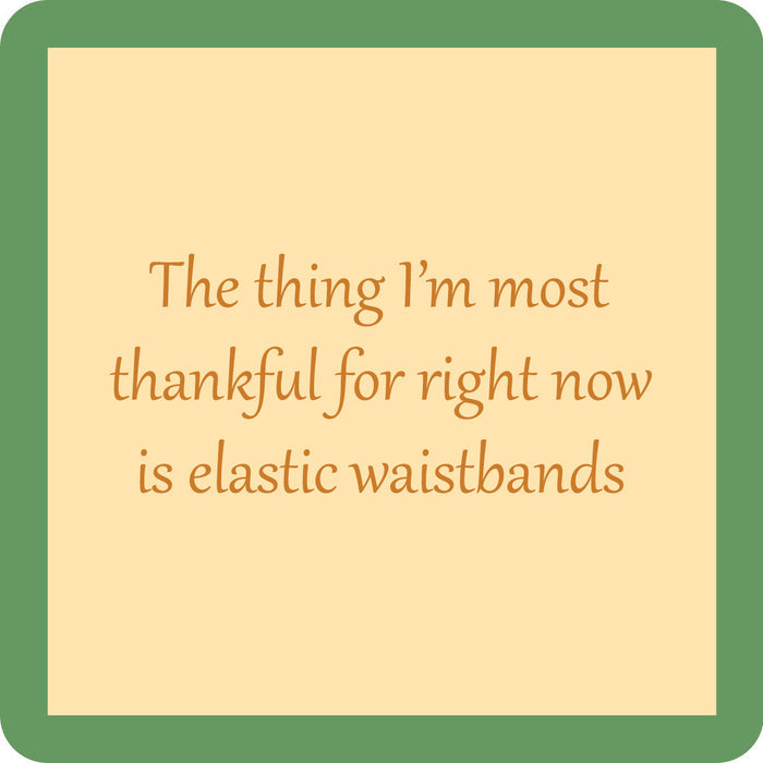 Drinks On Me’s Waistband Coaster features a beige square with a green border and the words “The thing I’m most thankful for right now is elastic waistbands” in a light brown font—ideal as a funny coaster or bar cart accent.