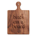 The Maple Walnut Artisan Paddle Board (9" x 6") features a handle, top hole, and "bites on a board" engraved in lowercase—ideal as a cheese serving board for your kitchen.