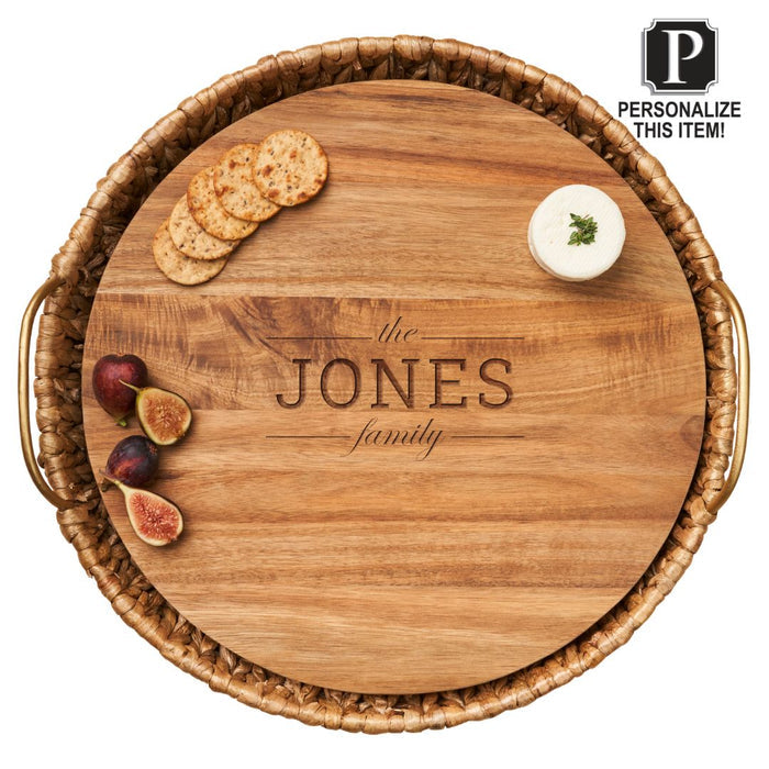 The Maple Water Hyacinth Round Tray with metal handles and acacia wood liner, personalized with the JONES family name, holds crackers, cheese, and figs. A label in the corner says: Personalize this item! Size: 17.5 x 17.5 x 4.5”.
