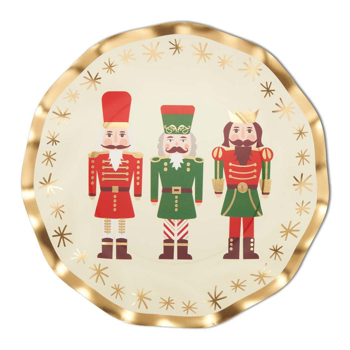 The Sophistiplate Wavy Salad Plate Nutcracker Christmas set (8/pkg) features a ruffled foil edge, three festive nutcrackers in red and green uniforms, and a gold starburst border for extra holiday cheer.