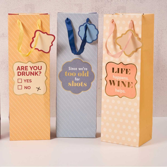 Drinks On Me Wine Helps- Wine Bag: Set of 3 tall, reusable wine bags with handles and funny sayings—ARE YOU DRUNK? YES/NO, Since we're too old for shots, and LIFE happens. WINE helps. Ideal for gifts or parties.
