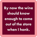 The Drinks On Me Wine Honk Coaster features white text on a maroon square with a light pink border—perfect as a funny housewarming gift or bar cart accessory.