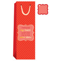 The Drinks On Me Wine Store–Wine Bag features red diagonal stripes, yellow handles, a label saying "I followed my heart and it led me to the wine store," plus a matching blank gift tag in the top right corner.