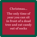 The Xmas Dead Tree Coaster by Drinks On Me features a red square design with a green border and white text: "Christmas... The only time of year you can sit in front of a dead tree and eat candy out of socks." A funny, festive coaster or hostess gift.
