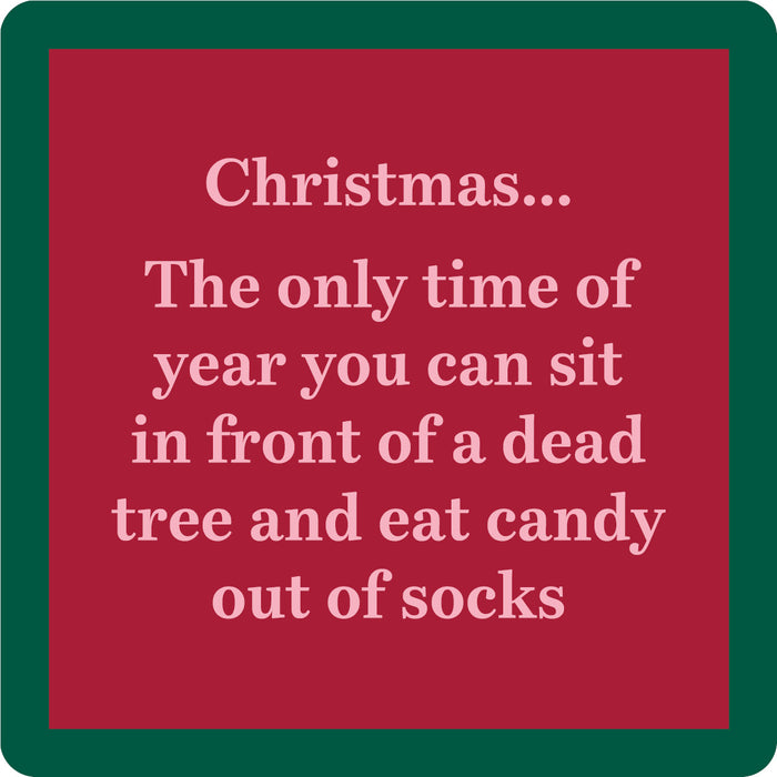 The Xmas Dead Tree Coaster by Drinks On Me features a red square design with a green border and white text: "Christmas... The only time of year you can sit in front of a dead tree and eat candy out of socks." A funny, festive coaster or hostess gift.