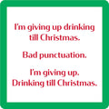 The Drinks On Me Xmas Punctuation Coaster features a text joke in red lettering on white with a green border: "I'm giving up drinking till Christmas. Bad punctuation. I'm giving up. Drinking till Christmas." Fun gift for any home!.