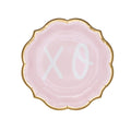 The Sugarplum XOXO Salad Plates/8pk feature round, light pink disposable plates with scalloped gold edges and bold white XO letters—perfect for Valentine’s Day or as chic pink party plates for any celebration.