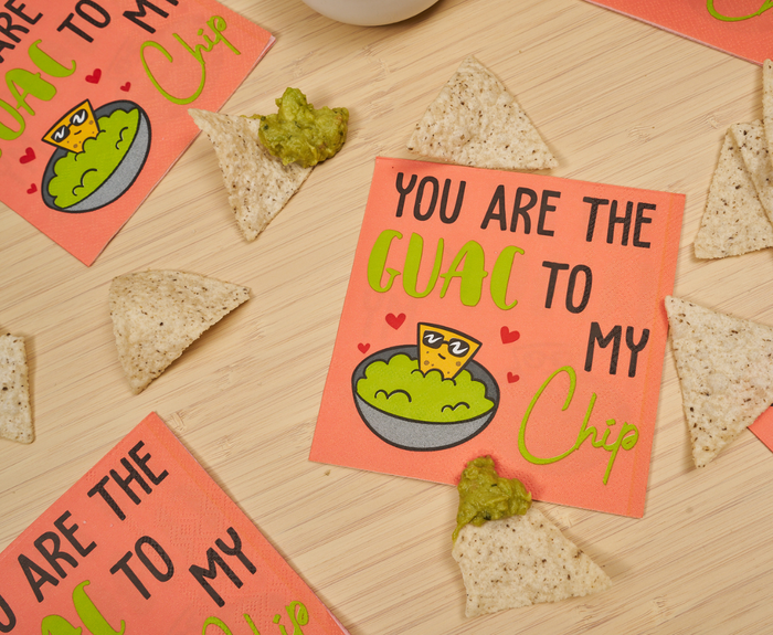 Add a playful touch to your next fiesta with Sugarplum's "You are the GUAC to my Chip" cocktail napkins (26pk), featuring coral color and fun chip-and-guacamole artwork—perfect for summer parties.