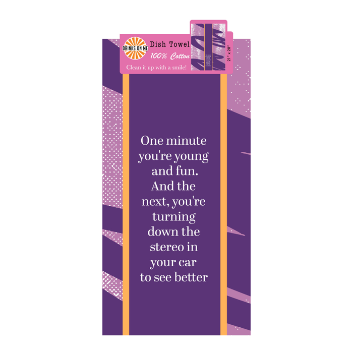 The Young and Fun Dish Towel by Drinks On Me is a humorous purple kitchen towel with orange edges and abstract pink patterns, featuring the witty text: “One minute you’re young and fun. And the next, you’re turning down the stereo in your car to see better.”.